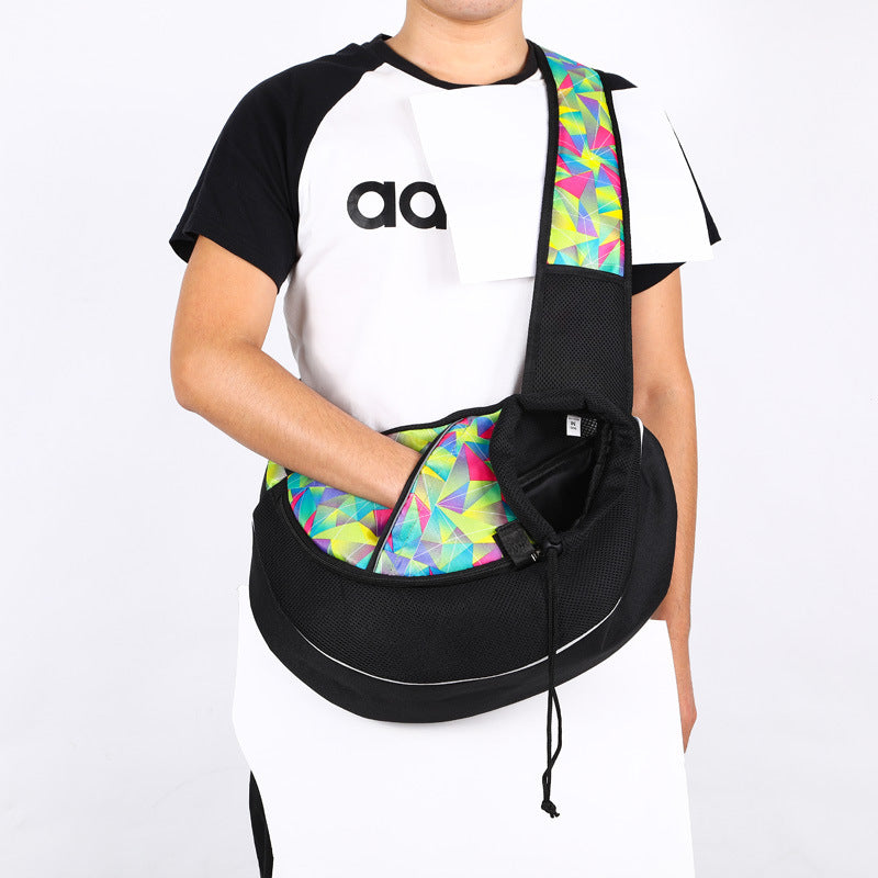 Pet Carrier Bag for Dogs & Cats shown on a person wearing a colorful crossbody design, ideal for portability.
