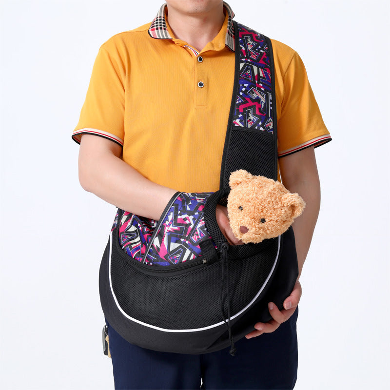 Pet Carrier Bag for dogs and cats being carried by a person in a yellow shirt, featuring a colorful crossbody design.
